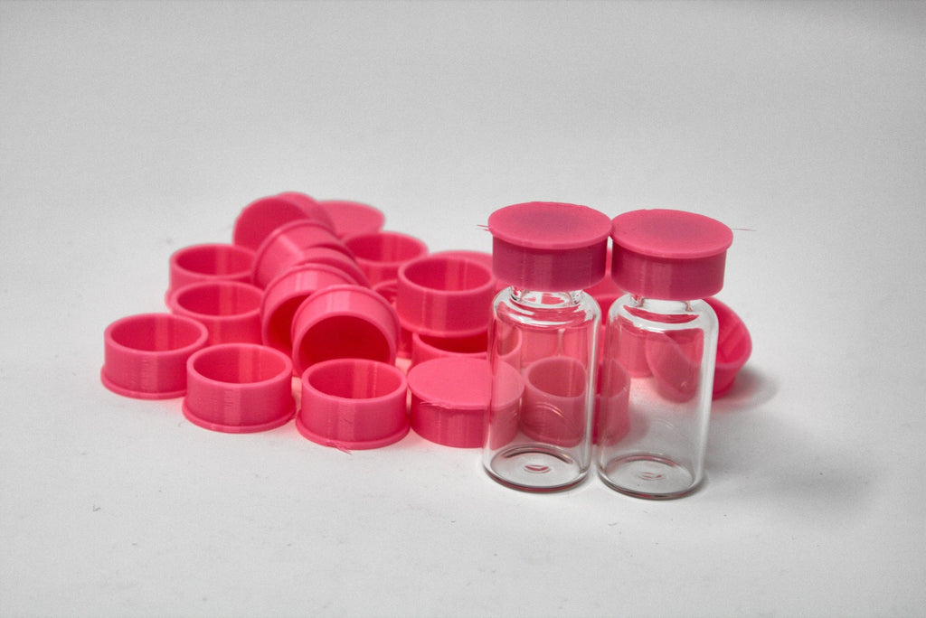 Pink reusable TPU vial caps with vials
