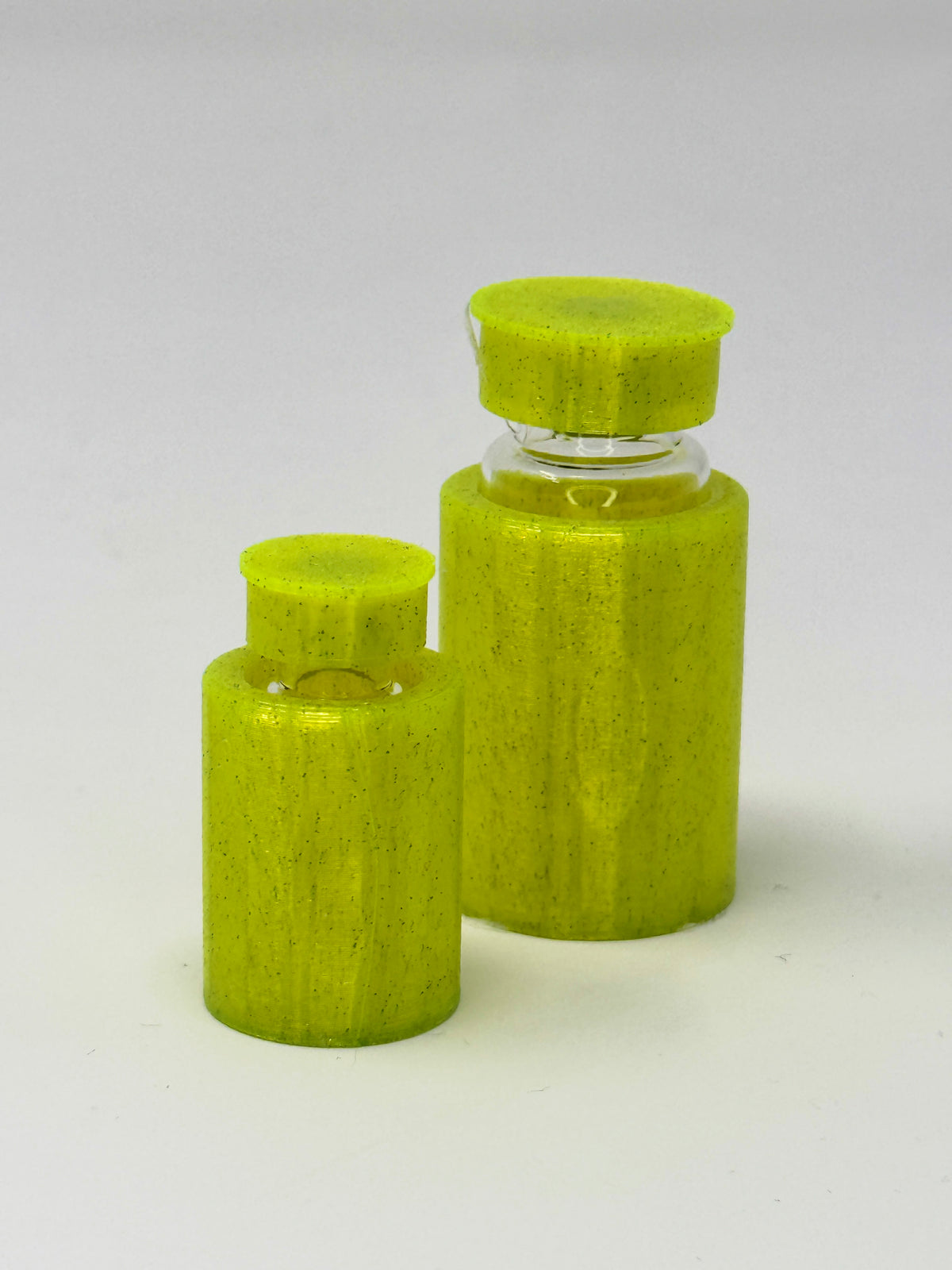 VialLock Yellow vial sleeves shown on 3 mL and 10 mL demonstration vials. Each order contains three sleeves of one selected size; matching caps included only with the cap option.